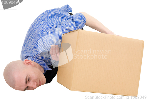 Image of Man looking under cardboard box