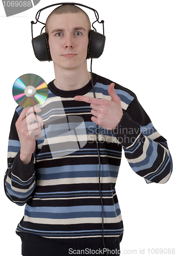 Image of The young guy with ear-phones and a compact disk