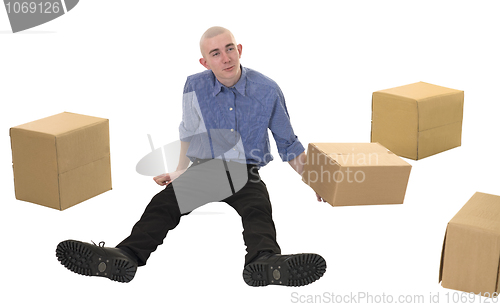 Image of Man and pile cardboard