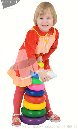 Image of Child in the red dress with toy 