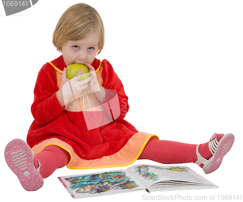 Image of Little girl with book and apple