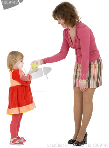 Image of Women give apple to the girl