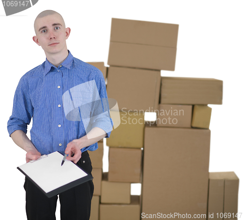 Image of Man and pile cardboard boxes