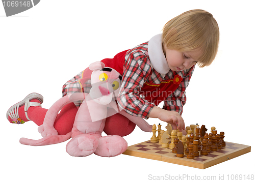 Image of Little girl play chess