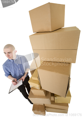 Image of Man and pile cardboard boxes