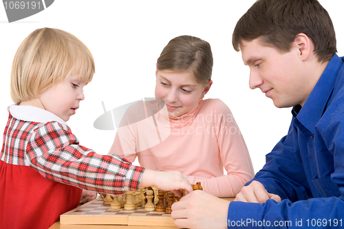 Image of Man and children play chess