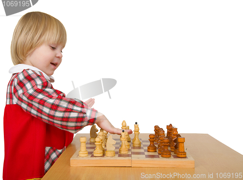 Image of Little girl play chess