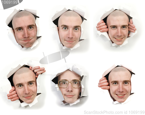 Image of Six faces looking through holes