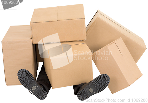 Image of Male feet under a heap of boxes