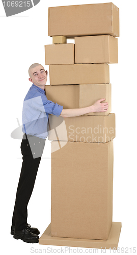 Image of Man embrace heap cardboard boxes