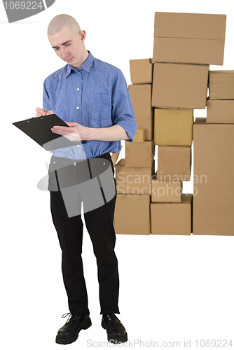 Image of Man and pile cardboard boxes 