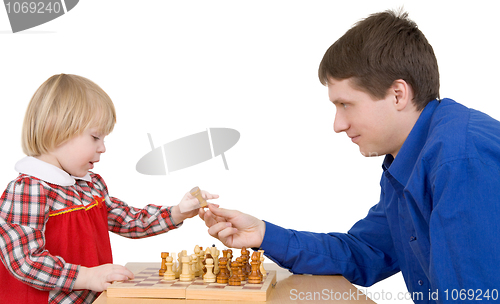 Image of Man give child chess-man