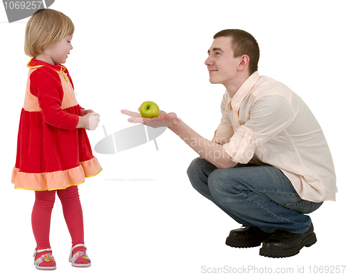 Image of Young man, apple and little girl