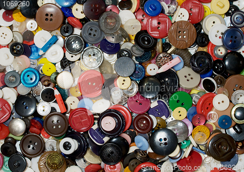 Image of Multicolored plastic and metal button background