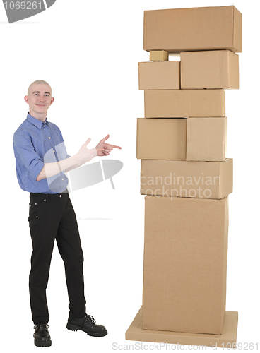 Image of Man showing on pile cardboard boxes