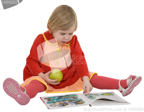 Image of Small girl looking book