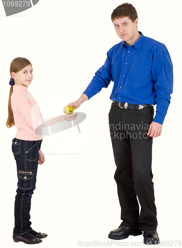 Image of Man give apple to girl