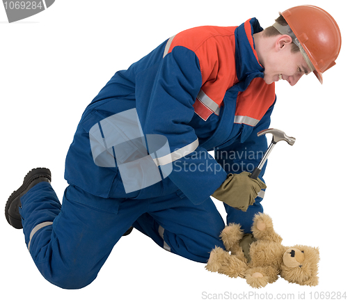 Image of Man with hammer and toy bear