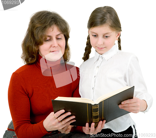 Image of Woman and girl reads a book