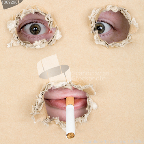 Image of Mug smoking a cigarette