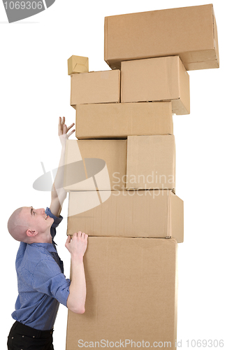 Image of Man trying get the most upper box