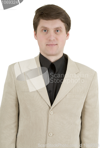 Image of Portrait of young businessman in beige suit