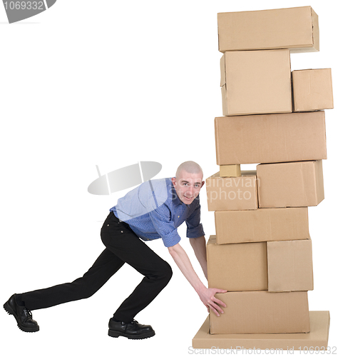 Image of Man pushing pile from cardboard boxes