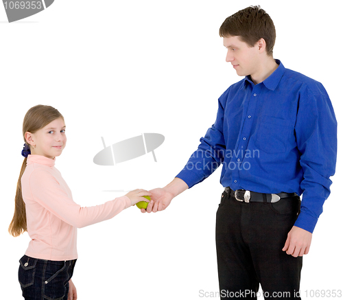 Image of Man give apple to the girl