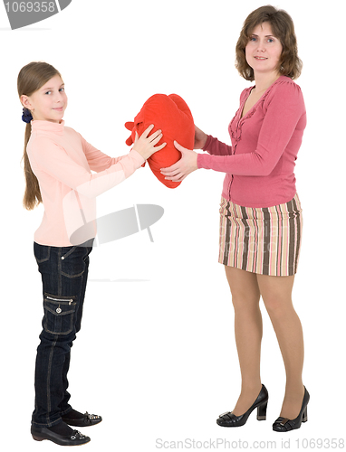 Image of Woman give heart to girl