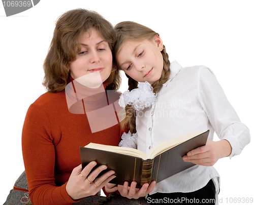 Image of Woman with girl reading book