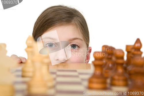 Image of Girl looking chess