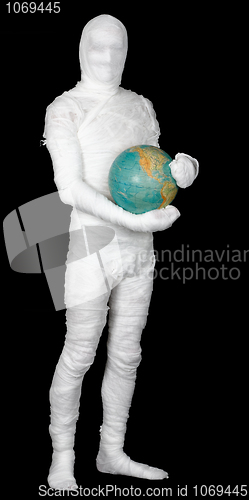 Image of Man in costume mummy and terrestrial globe