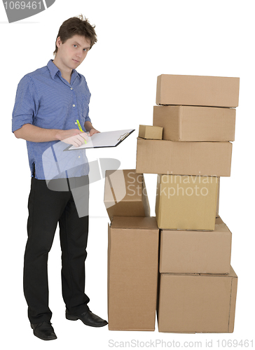 Image of Man with marker and pile cardboard boxes