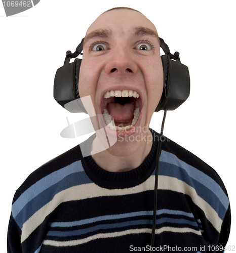 Image of Man in ear-phones yelling songs