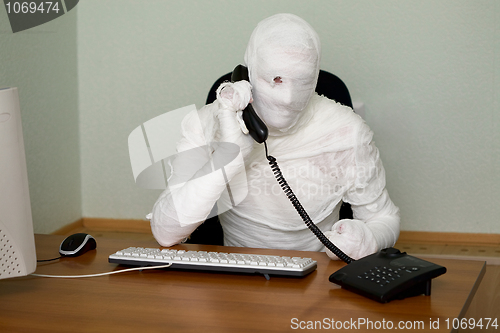 Image of Businessman mummy with telephone