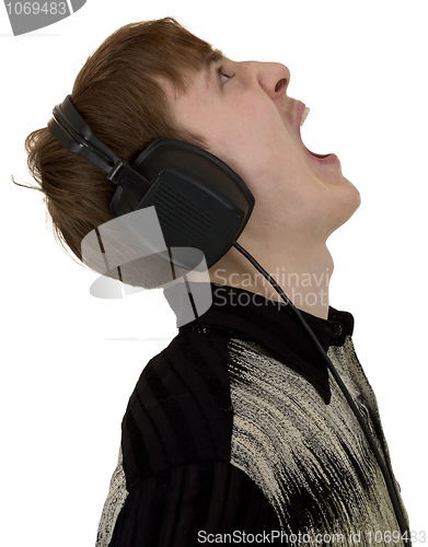 Image of Young man yell with ear-phones