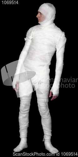 Image of Guy in bandage upright on a black