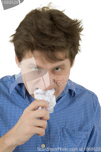 Image of The man a chewing sheet of paper