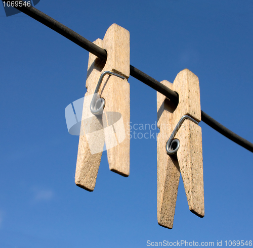 Image of Two wooden clothes-peg