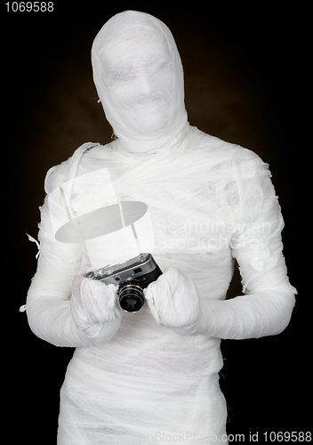 Image of Mummy with retro camera