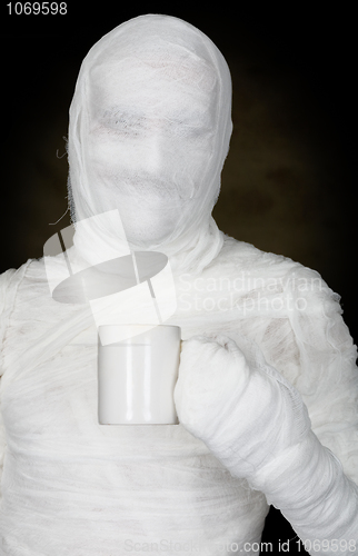 Image of Man in bandage with mug