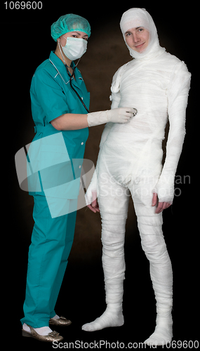 Image of Man in bandage and nurse with stethoscope