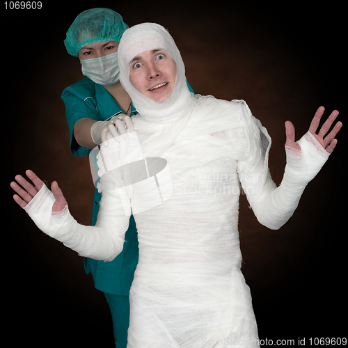 Image of Man in bandage and nurse