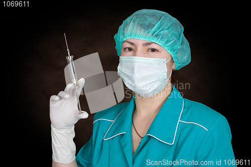 Image of Nurse with syringe in hand