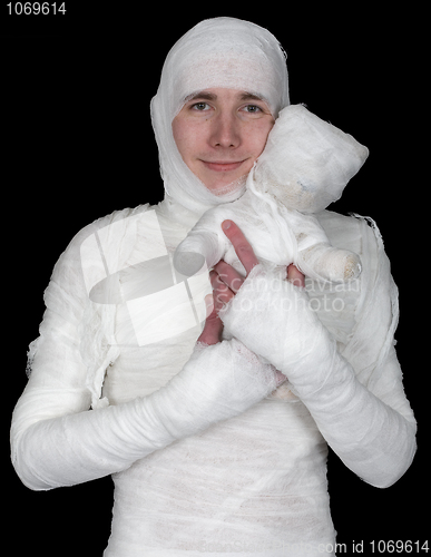 Image of Sentimental man in bandage with mummy bear