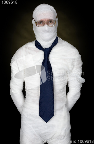 Image of Man in bandage with eyeglasses and  the cravat