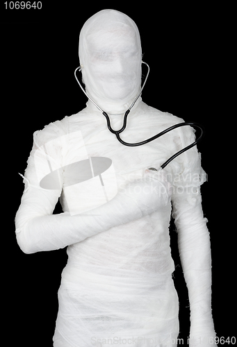 Image of Man in costume mummy with stethoscope