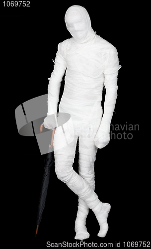 Image of Man in costume mummy and umbrella