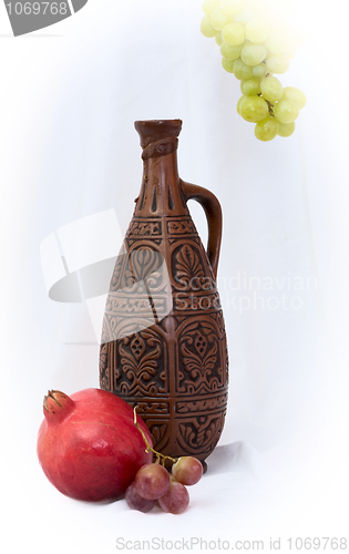 Image of Still-life with a bottle and pomegranate