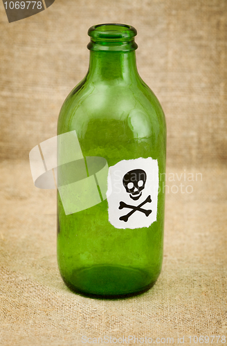 Image of Bottle with sticker - skull and crossbones